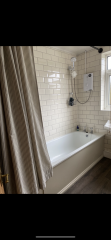 New bathroom with shower curtain?