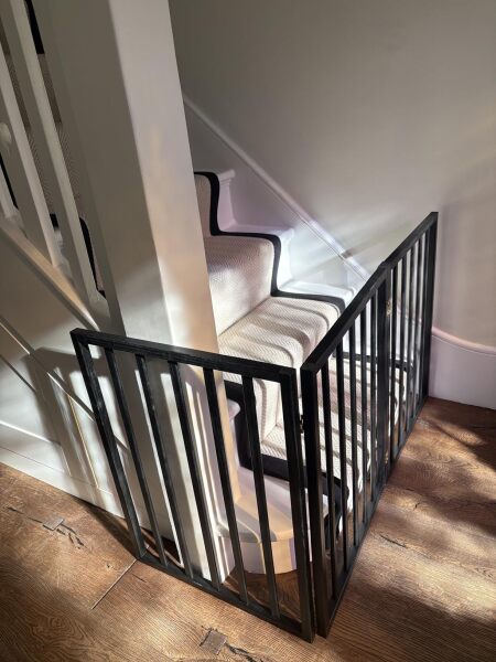 Has anyone got a freestanding pet barrier at the bottom of their stairs?