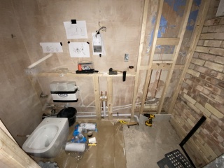 Help! Shower waste level trouble - how to adjust this copper to cast iron junction? (Pics)