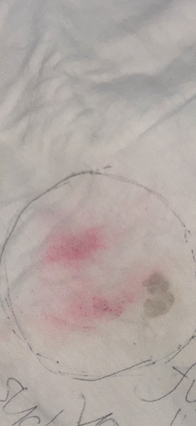 Does this look like a lipstick stain on his t shirt?