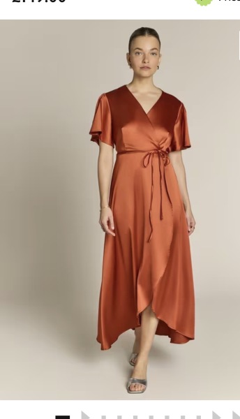 Another wedding guest one - middle aged with tum and big boobs.