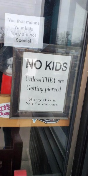What do you think of these signs on a shop door?