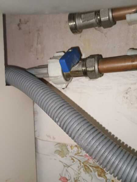 How can I loosen a stuck washing machine supply pipe nut?