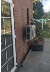 Ideas for hiding this air con unit please