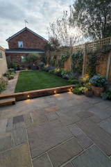What could I plant to soften new fencing and bare borders?