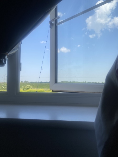 How can I keep my window partly open in the wind?