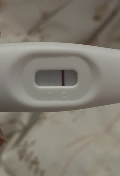 Can anyone see a faint positive line on this pregnancy test?