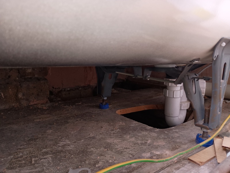How worried should I be? Missing floor planks below bath