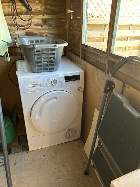 Tumble dryer in an uninsulated outbuilding: what works long term?