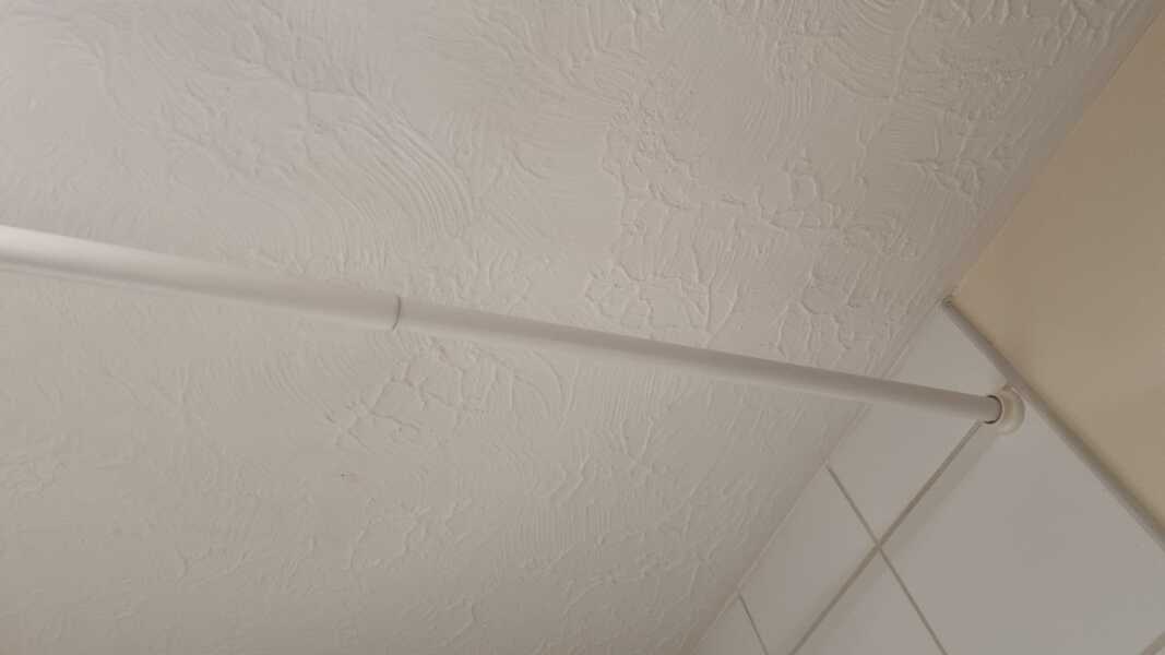 How do you put a shower curtain on the rod?