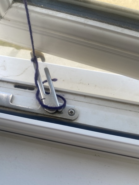 How can I keep my window partly open in the wind?