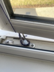 How can I keep my window partly open in the wind?