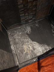 How can I remove white Dettol residue from a shower tray?