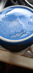 Dishwasher leaving sandy food residue on cups on the top shelf