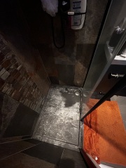 How can I remove white Dettol residue from a shower tray?