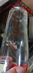 Dishwasher leaving sandy food residue on cups on the top shelf