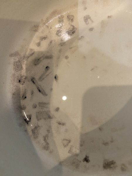 How do I remove burnt food from a Le Crousette pan?