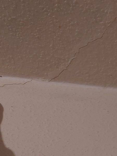 Diagonal crack above internal door and into ceiling, should I worry?
