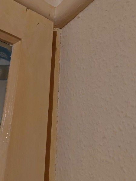 Diagonal crack above internal door and into ceiling, should I worry?