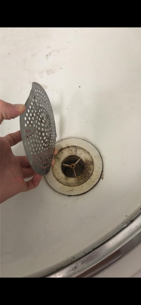 Is my son responsible for shower damage caused by a loose drain cover?