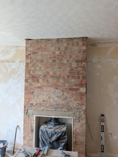 Best plastering materials for a chimney breast around a log burner