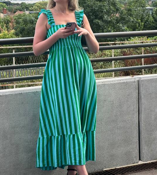 Can anyone identify this two-tone green striped dress from last night?