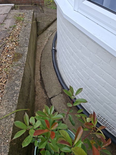 How can I improve drainage on a concrete front area?
