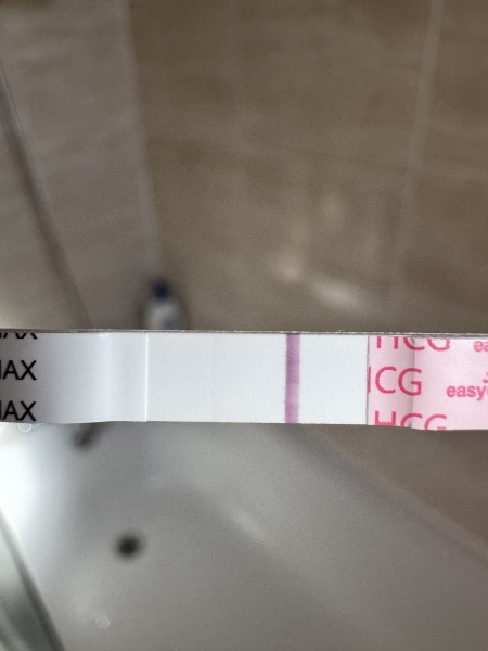 Faint line on test, does this look positive? Please help :)