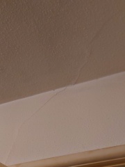 Diagonal crack above internal door and into ceiling, should I worry?