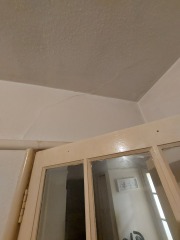 Diagonal crack above internal door and into ceiling, should I worry?