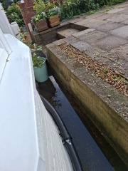 How can I improve drainage on a concrete front area?