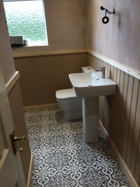 Would fully tiling a large bathroom feel too clinical and hard to clean?