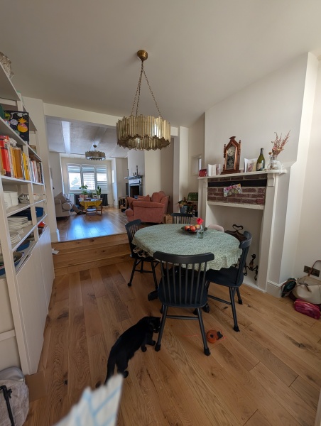 To knock out this chimney breast and put a wall of cabinets where the stairs are?