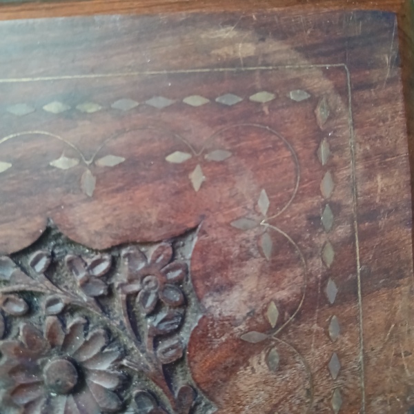 Can I get rid of these marks on wooden inlaid table?