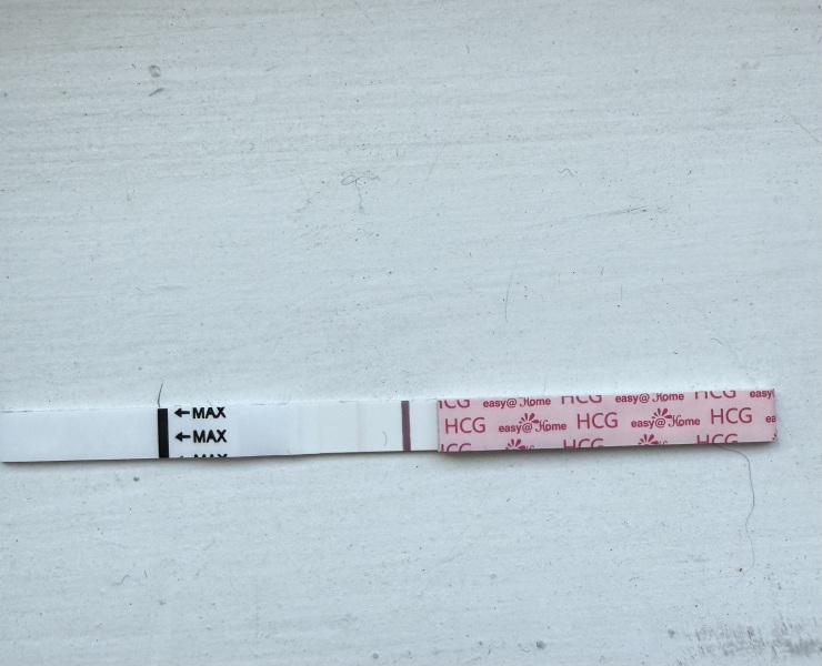 13DPO with spotting, cramping and faint line, period or pregnancy?