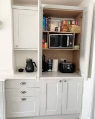 AIBU to think it’s fine to use an air fryer whilst it’s inside of a cupboard?