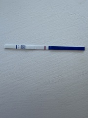 Possible faint positive at 9dpo or just an evaporation line?