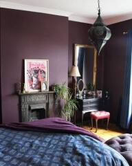 Plum walls and grey bedroom: throw and wall art ideas