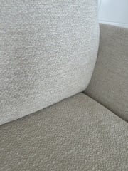 Best way to clean a light bouclé sofa with fixed cushions