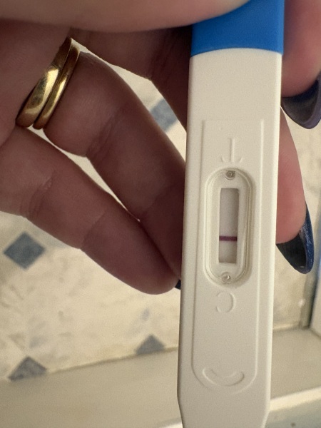 Could this unusual bleeding pattern still mean pregnancy despite a negative test?