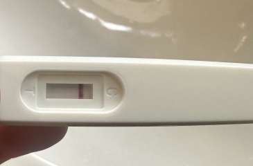 One week late period, sore breasts and cramps, negative test