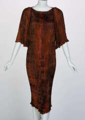 What could I wear over a Fortuny style dress for a wedding?