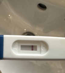 One week late period, sore breasts and cramps, negative test
