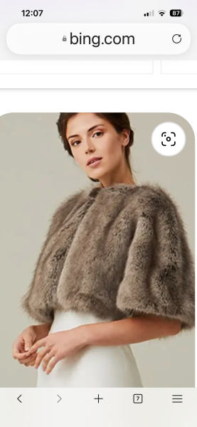 What jacket or cover-up would suit this dress for a daytime wedding?