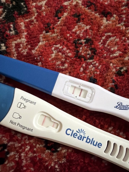 Are these early pregnancy tests positive despite period-like symptoms?