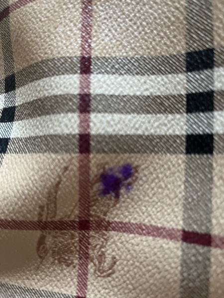 How can I remove dried biro ink from a leather bag?