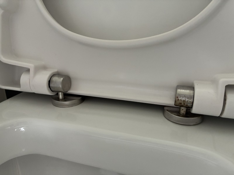 How on earth do I remove this toilet seat?