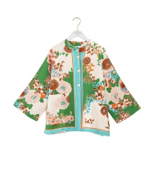 What jacket or cover-up would suit this dress for a daytime wedding?