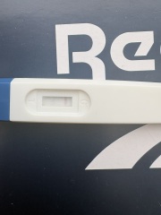 Faint positive then negative test with symptoms at 31 days