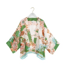 What jacket or cover-up would suit this dress for a daytime wedding?